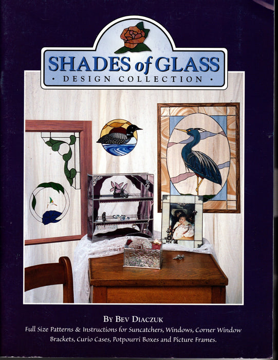 Shades of Glass, Design Collection, Instructional Glass Art Pattern Book by Bev Diaczuk •	Inside are: •	Color Photos •	Full-Size Patterns •	Glass Art Build instructions for Suncatchers, Windows, Corner Window Brackets, Curio Cases, Boxes and Picture Frames A terrific Glass Artist Gift Present Happy Glass Art Supply www.happyglassartsupply.com